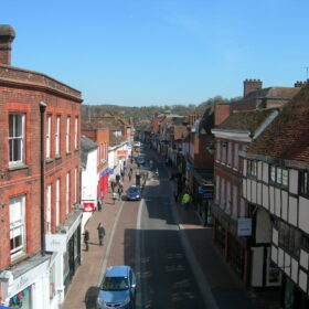 View of Godalming High Street from the top of The Pepperpot with blue skies