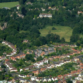 Aerial view of Farncombe showing rooftops and The Manor House at the top of Farncombe Hill